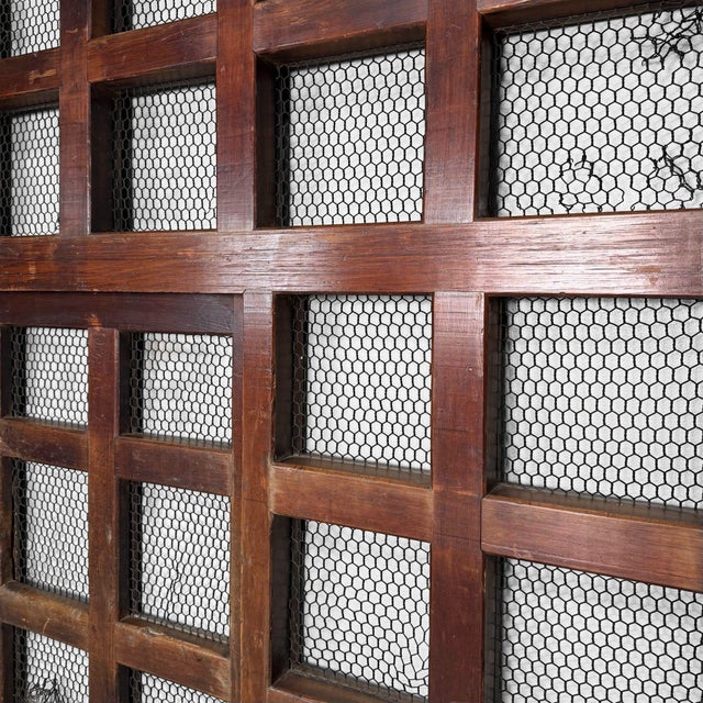 This original Japanese sliding door (hikido) is a striking architectural element with a calm, graphic presence....