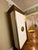 Beautiful Global Views Framed Tall Cabinet is made of hardwood construction with brass sheeting and cast resin panels,...