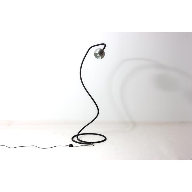 "Serpente" floor lamp by Isao Hosoe for Valenti, Italy, 1970s. Flexible tubular body in black, allowing the lamp to be...