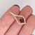 A Mozambique ruby glows with red brilliance at the heart of this pear pendant, framed by a trail of brilliant natural...