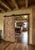 This handcrafted solid wood barn door features an elegant carved Classical Scroll Pattern with soft, flowing geometry —...