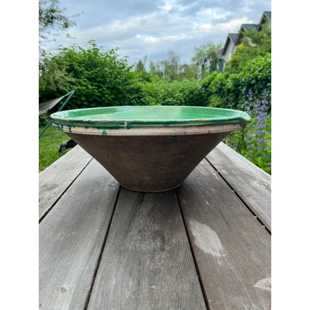 Statement-sized antique French bowl. Glazed on the inside with a natural earthenware/terra-cotta finish on the outside.