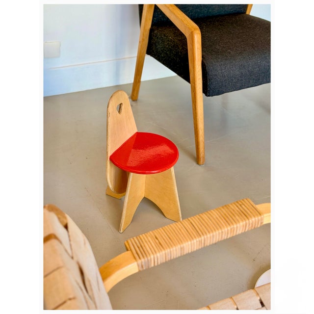 This vintage children’s chair was produced by Dutch manufacturer Van Dijk and is crafted from laminated birch plywood with...