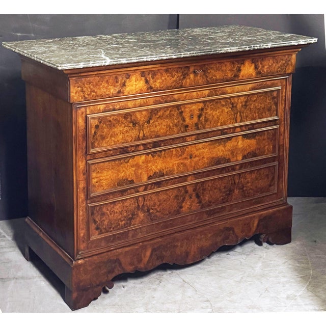 A fine Louis Philippe console chest or commode from France, of beautifully patinated burled walnut with a figured marble...