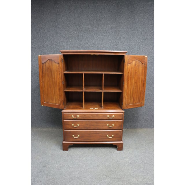 Upper double doors with shaped panel fronts Adjustable interior shelves with cubby dividers (ideal for linens, sweaters,...