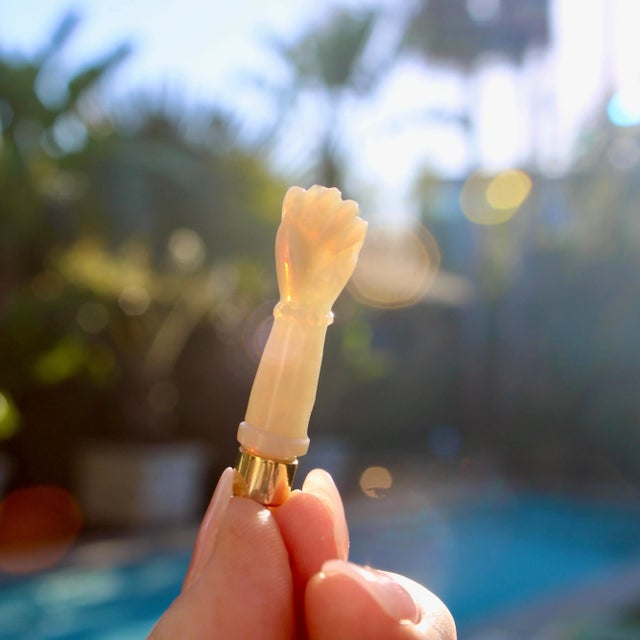 This is part of Chairish’s Fine Jewelry assortment. Carved from opal, this beautiful Figa pendant shimmers in the...