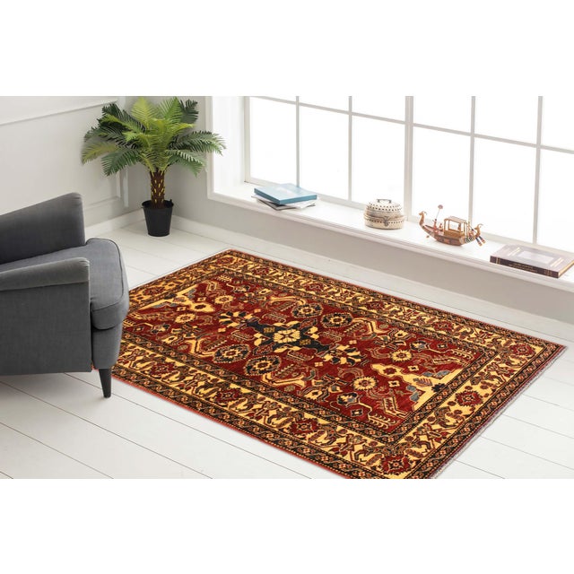 Enhance your home with this exquisite hand-knotted Super Kazak rug, crafted from fine hand-spun wool and dyed with all-...