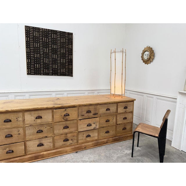 A beautiful workshop cabinet with 21 drawers, dating from the 1900s. The charm of its patina and shell handles, along with...