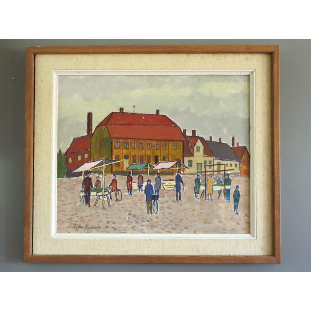 MARKET DAY IN THE SQUARE Size: 19.9 x 23 inches(including frame) Oil on board A charming mid-century Naïve style street...