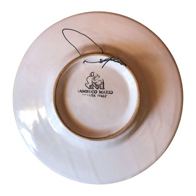 A distinguished hand-painted majolica portrait plate from Deruta, Italy, featuring a classical Renaissance-style gentleman...