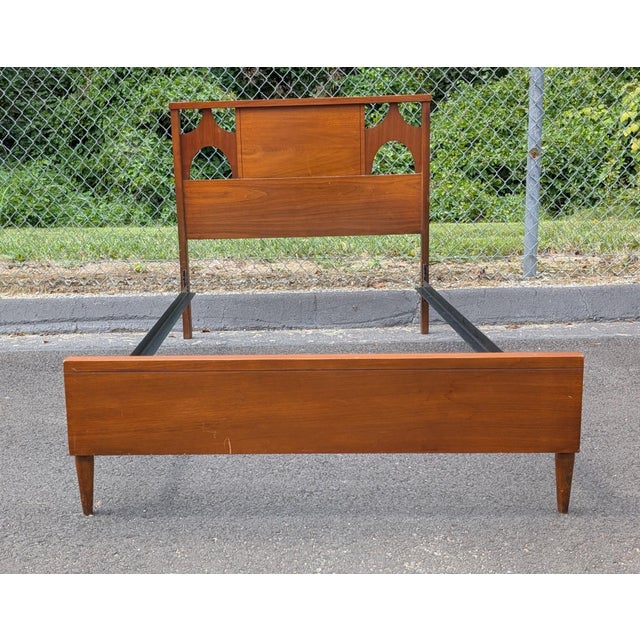 Elevate a bedroom, guest space, or child’s room with the warm tones and timeless architectural lines of this Mid-Century...