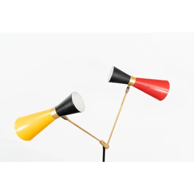 Diabolo vintage floor light. The light comes with two diabolo type shades and can be rearranged into multiple positions....