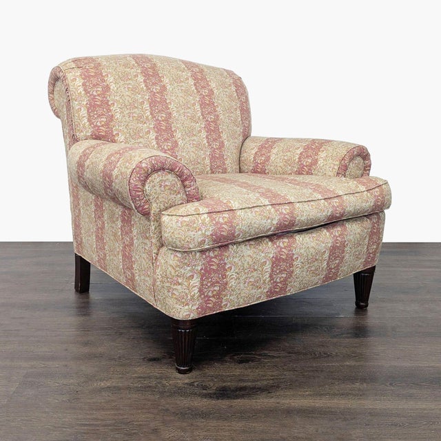This lounge chair by Ralph Lauren features a classic striped floral upholstery in soft pink and cream tones. It has rolled...