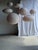 Medium-sized, round, pale pink Japanese-style rattan and natural linen pendant light. Beautifully handcrafted: natural...