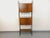 Vintage Scandinavian-style bookcase from the 1960s, Italian design, made of walnut wood and black metal, with adjustable...