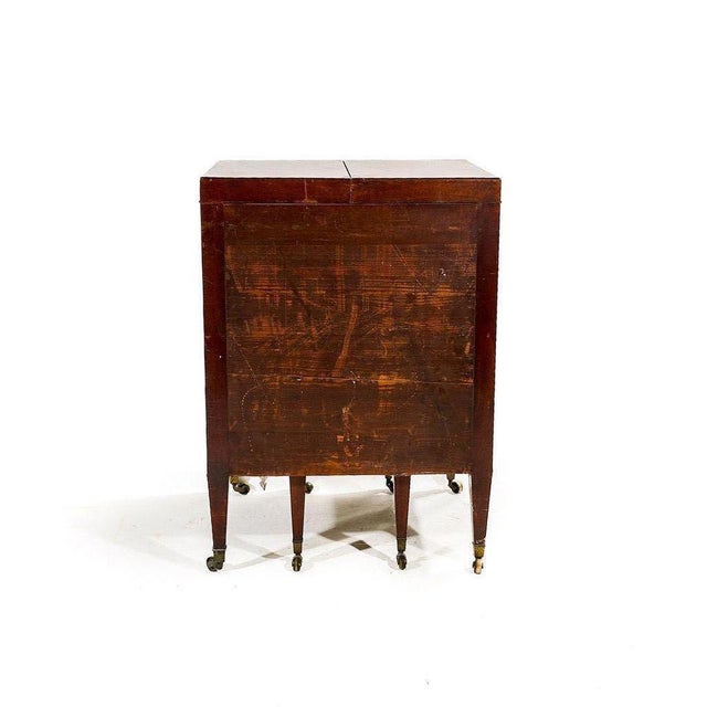 An elegant English mahogany shaving cabinet, dating from the first half of the 19th century (circa 1825-1845). This...