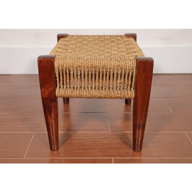 Stylish vintage Danish style woven paper cord and teak wood foot stool. It is in very good vintage condition overall with...