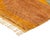 A bold, fluid burst of color and movement — abstract lines radiate outward across a warm ochre field, like a compass rose...