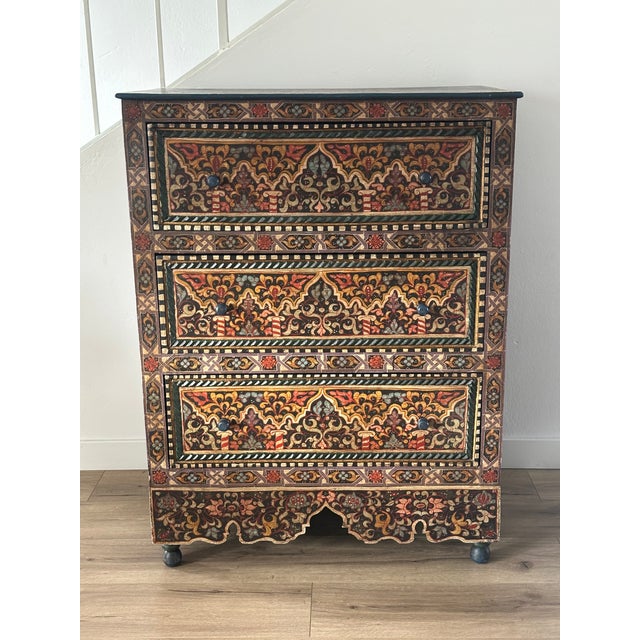 A stunning statement piece covered in intricate hand-painted arabesque and geometric artwork on every surface. Rich tones...