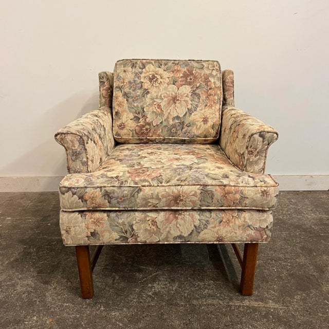 Floral patterned arm chair with wooden legs. Initially I thought this was dunbar but sure construction is quality but does...