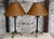 Rustic yet dainty table lamp pair featuring a cute crinkled oiled paper shade, with finial. They are of a tripod design...