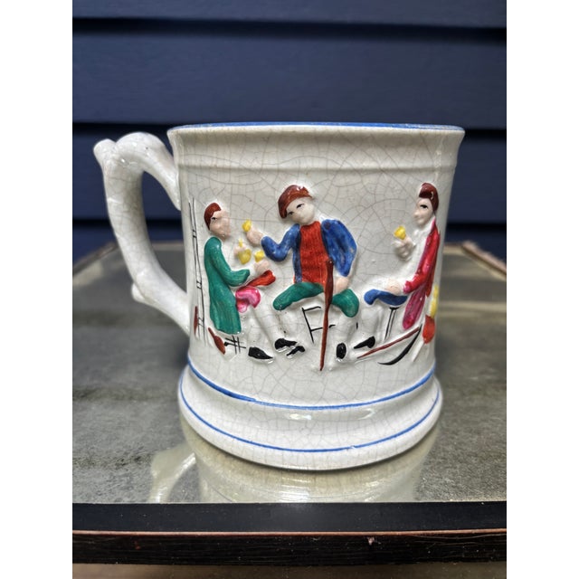 An oversized Staffordshire "Mystery" Mug, late 19th century England. When it is filled, it looks normal enough--as the...