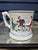 An oversized Staffordshire "Mystery" Mug, late 19th century England. When it is filled, it looks normal enough--as the...