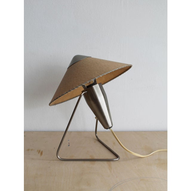 An iconic Czechoslovak modernist table and wall lamp designed by Czech jewellery artist and designer Helena Frantová in...