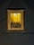 Decorative framed autumn forest print featuring bright yellow trees, warm brown matting, and a classic dark wood-tone...