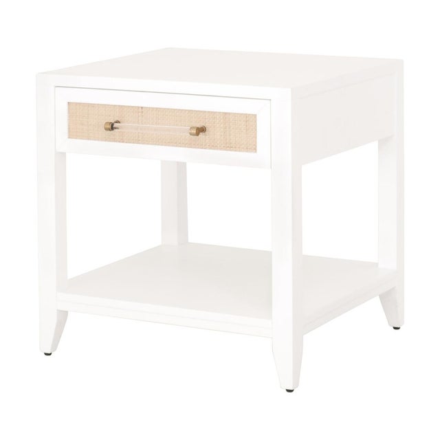 This transitional side table nicely blends design styles taken from tropical, traditional, and modern looks. The storage...