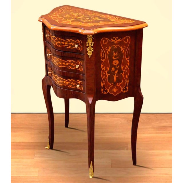 Elegant and compact, this French Louis XV-style side table features a beautifully curved silhouette, rich wood finish, and...