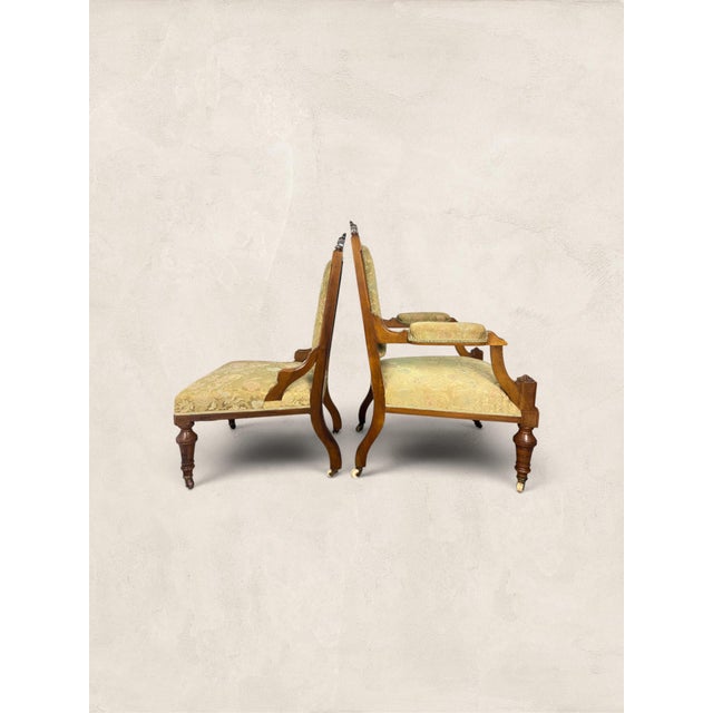 Antique English Eastlake "His and Hers" Walnut Parlor Chairs Matched parlor sets from the Eastlake period are genuinely...