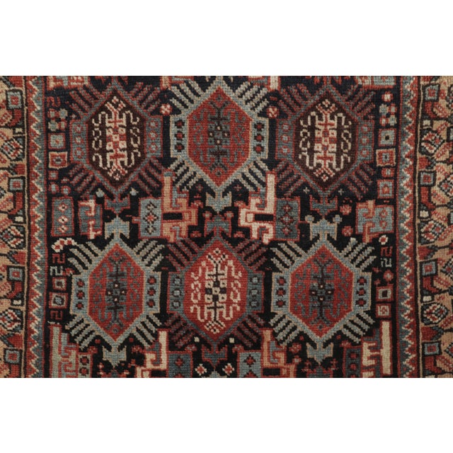 Hand-knotted in wool and originating circa 1920-1929 from Persia, this 2x2 antique Persian Shiraz rug joins Rug & Kilim’s...