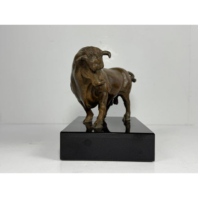 Stunning Bronze Bull on Black Marble Pedestal Base. Approximately 10 lbs. total weight. Artist and age unknown.