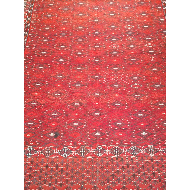 Discover the exceptional artistry and rich heritage of this magnificent Mid-20th Century Vintage Turkmen Yomut Soumak Rug....