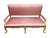 This French Louis XV style settee features a distinctive pink polka-dot upholstery and a gilded wooden frame Measuring...