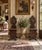 A striking pair of antique Italian Renaissance Revival hall chairs crafted from richly toned walnut and adorned with...