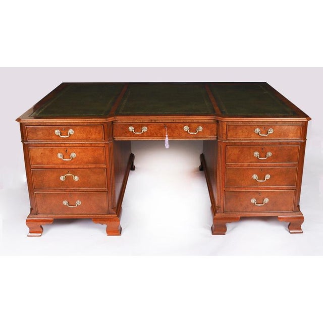 This is a superb and rare antique burr walnut Victorian Revival twin pedestal partners desk, Circa 1900 in date. It is...