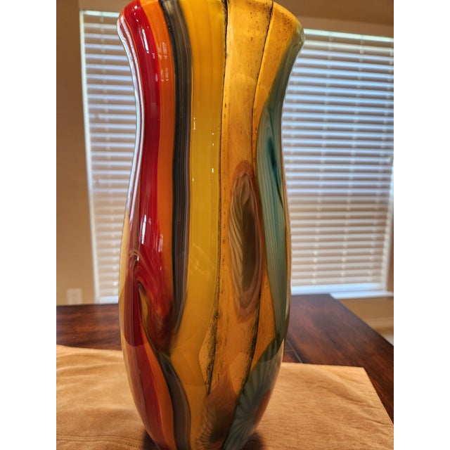 Add this home decor glass vase to your collection with this breathtaking hand-blown art glass vase. Featuring a vibrant...