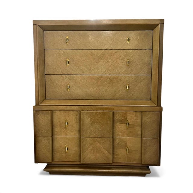 A striking and hard-to-find American of Martinsville mid-century bedroom set featuring a beautifully crafted highboy...