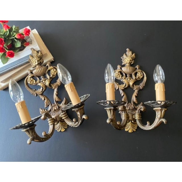 The sconces are made of brass and bronze - luxurious artistic forging. Very elegant work! Dimensions of each sconce:...