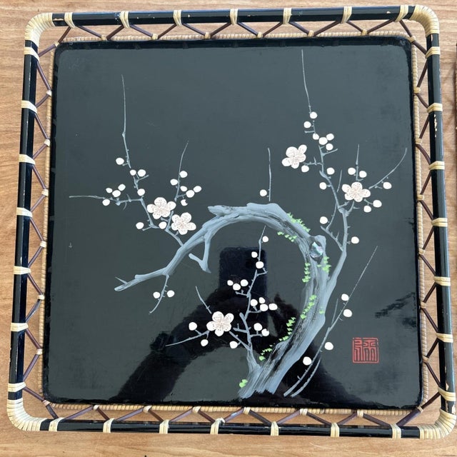 Pair of vintage Japanese lacquer trays featuring hand-painted plum blossom branches with delicate mother-of-pearl inlay...