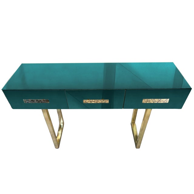 This spectacular green console table is an extraordinary piece of furniture that combines mid-century modern aesthetics...