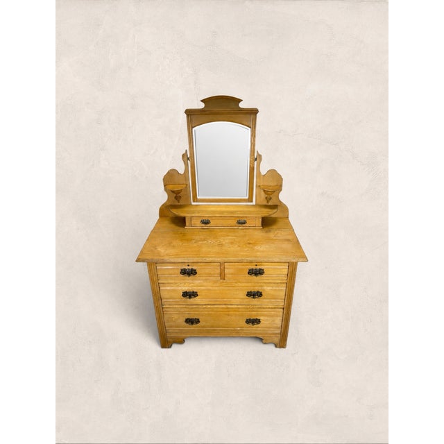 Antique English Pine Dressing Table Built for the daily rituals of an Edwardian bedroom, this pine dressing chest carries...