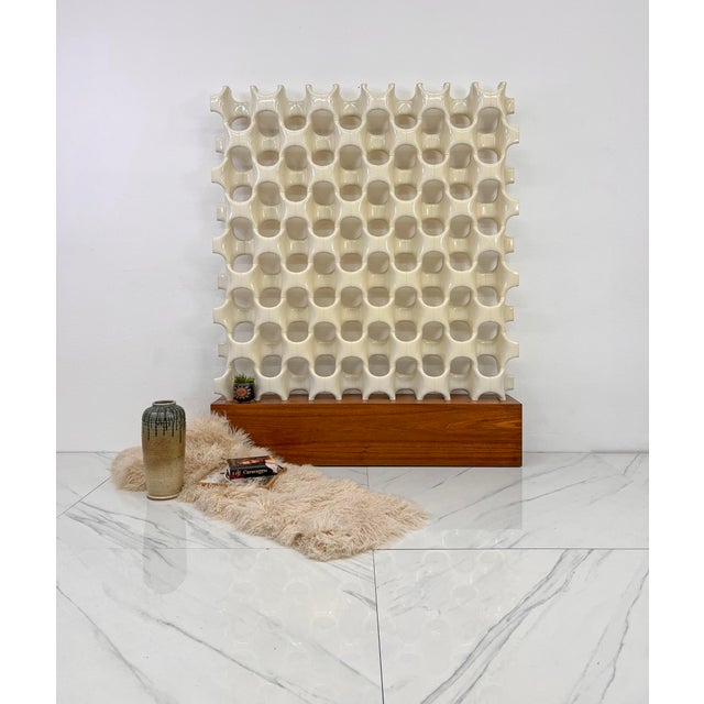 This isn’t just a room divider. This is a tanned, well-traveled, effortlessly bronzed bombshell who’s been sunning her...