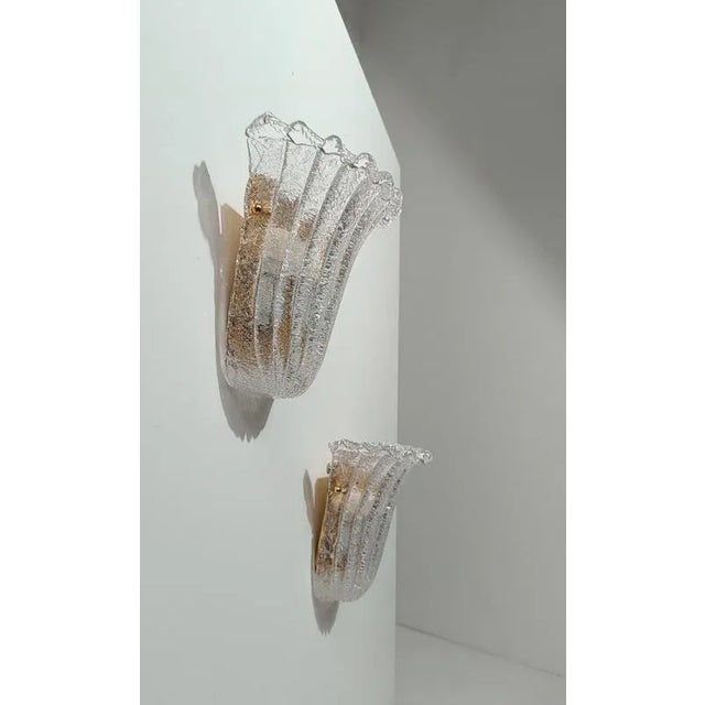 Elegant pair of sconces made in Italy between the 1980s and early 1990s, inspired by the timeless elegance of early 20th-...