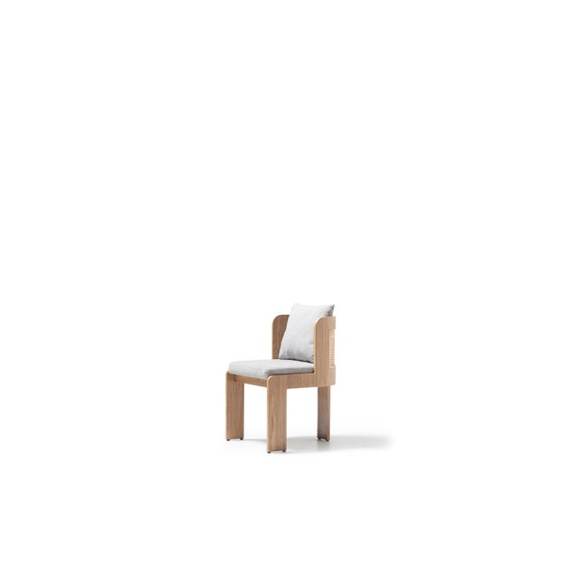 The Teddy Dining Chair blends modern elegance with natural warmth, offering a refined seating solution rooted in...