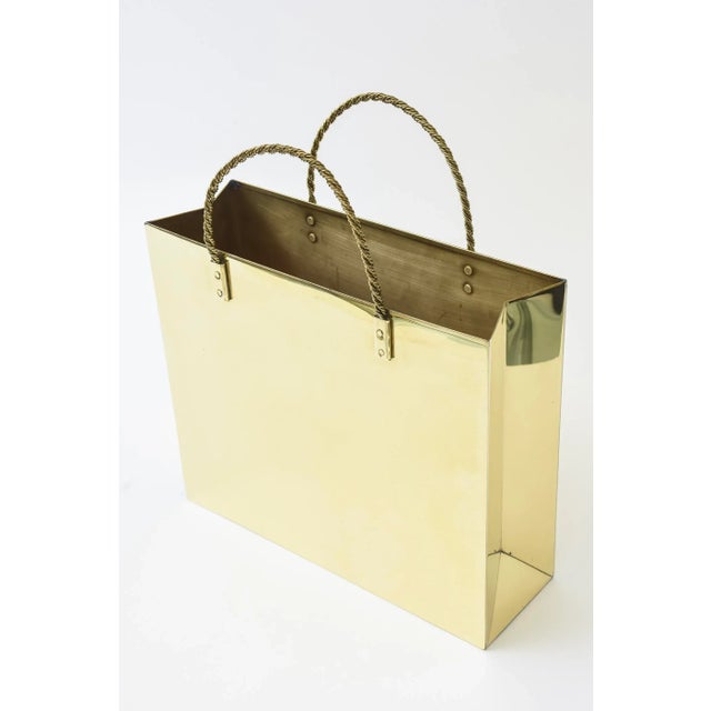 This vintage shopping bag sculpture and or magazine holder has braided handles. It is from the 70's. It was just polished...