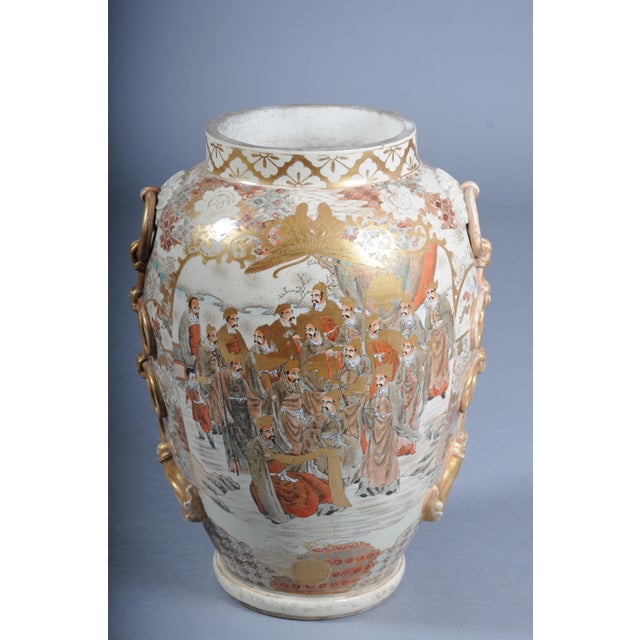 Antique Japanese Satsuma vase from the Meiji period (late 19th to early 20th century), traditionally hand-painted and...