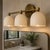 Handcrafted Solid Brass 3-Light Wall Sconce, Antique Brass Vanity Light With White Shades For Sale - Image 6 of 8